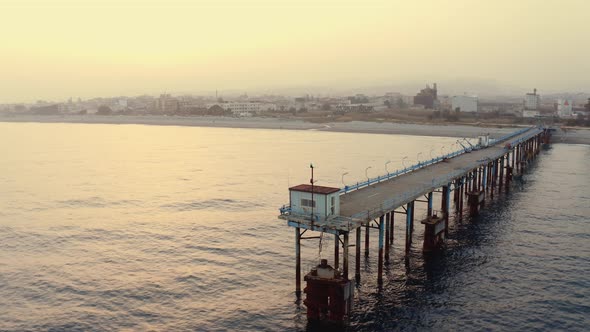 Aerial view of jetty at sunset alt