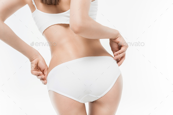 cropped view of woman in white underwear showing her butt isolated on white  Stock Photo by LightFieldStudios