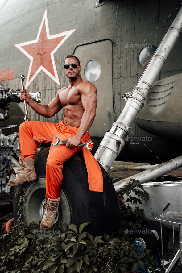 Strong Bodybuilder And Soviet Helicopter In Airport Stock Photo By Fxquadro