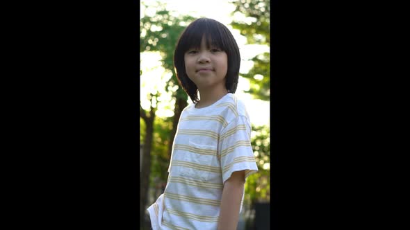 Close Up Of Happy Asian Child Outdoor alt