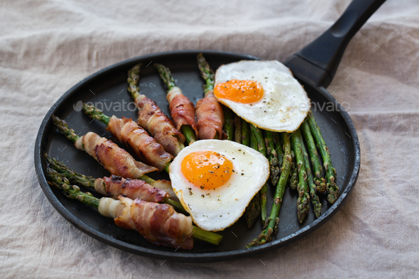 Keto, ketogenic breakfast, meal with fried eggs, bacon, asparagus Stock  Photo by antoninavlasova
