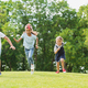 Four Glad Kids Happily Playing And Running Together On Green Lawn Stock  Photo, Picture and Royalty Free Image. Image 74181270.