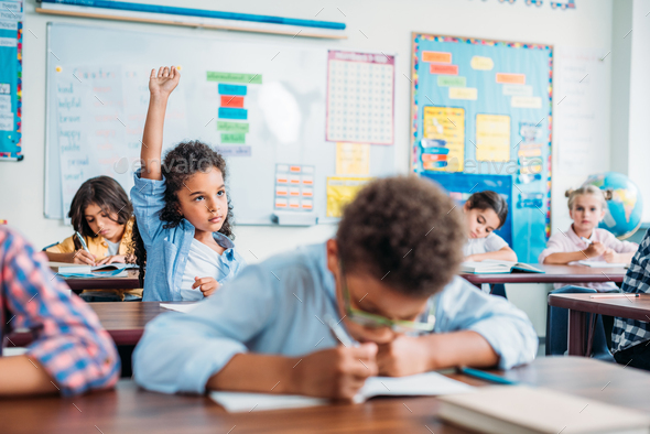 african american girl raising hand in class Stock Photo by ...