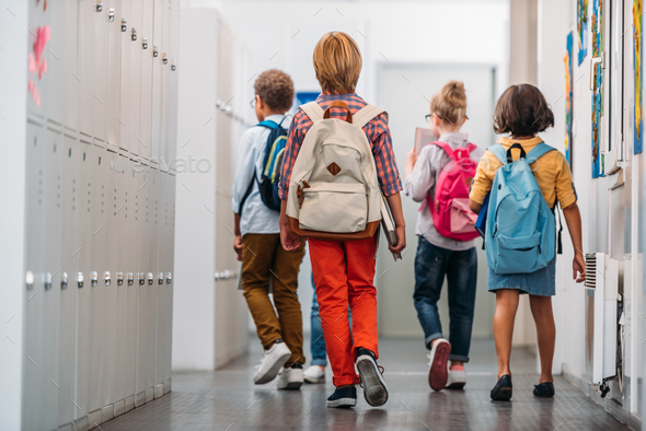 back view of kids going in class through school corridor Stock Photo by ...