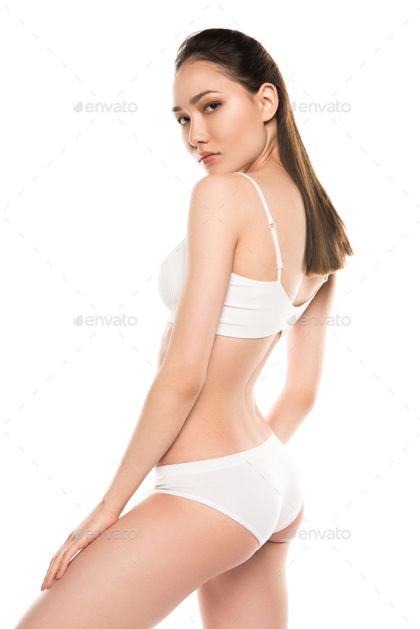 slim beautiful seductive asian woman in white underwear, isolated on white  Stock Photo by LightFieldStudios