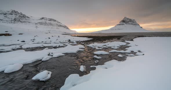  Timelapse of Bright Susnet Over Kirkjufell Mountain. Iceland in the Early Spring