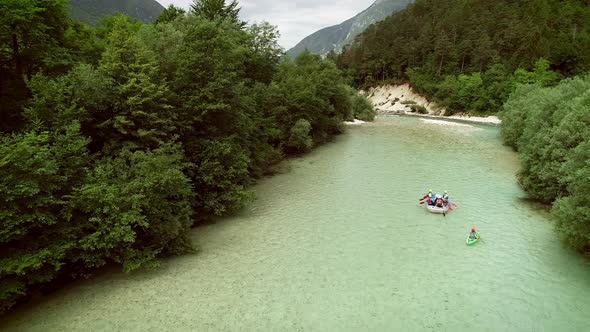 Aerial view of a group of people rafting on the Soca river, Slovenia. alt