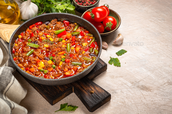 Chili con carne in skillet. Minced meat with vegetables.