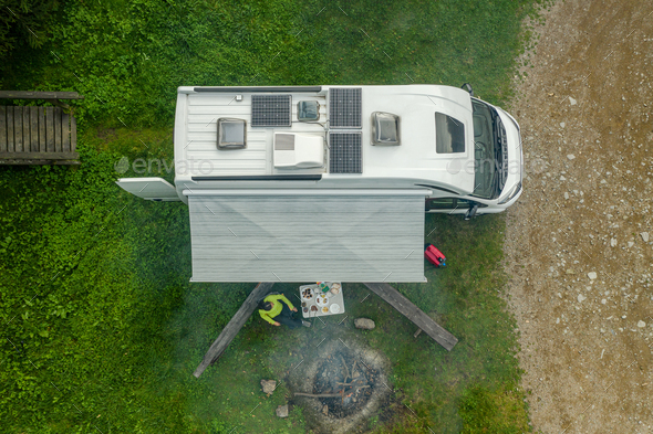 RV Park Pitch with Camper Van and Campfire Place Aerial View