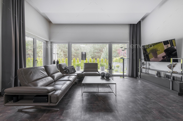 Big window in trendy grey living room interior of suburban house - Stock Photo - Images