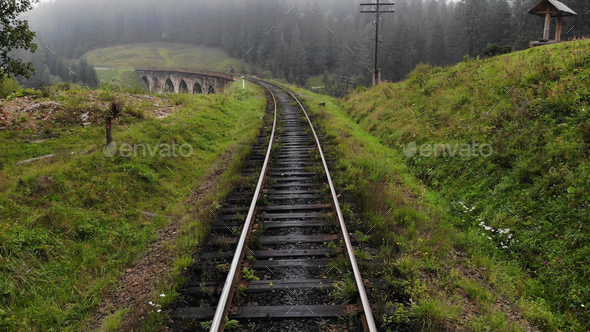 Amazing scenery of railroad on the green hills.