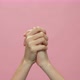 Close up of hand clapping on the pink background. celebration concept. - VideoHive Item for Sale