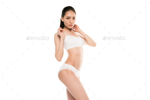 Chinese Woman Posing in Panties and Bra on White Background Stock