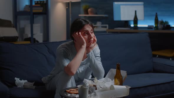 Upset Depressed Disappointed Woman Looking Lost on Tv alt