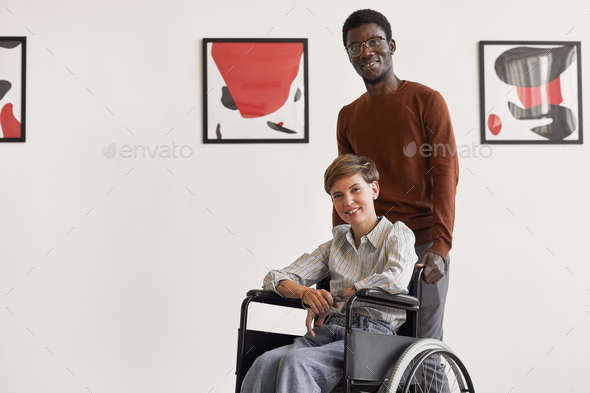 Disabled Woman Visiting Art Museum with Caregiver - Stock Photo - Images