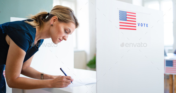 Portrait of woman voter in polling place, usa elections concept