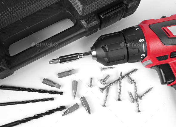 Cordless electric screwdriver with case and drill bit set on white background