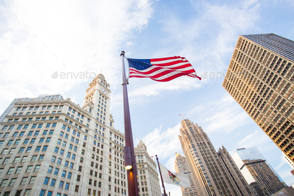 Trump Tower in downtown Chicago with the USA flag flying nearbny on a hot summer’s day