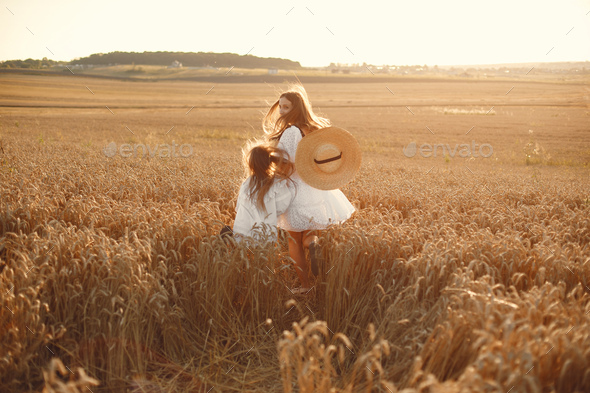 Mother with daughter in a wheat field - Stock Photo - Images