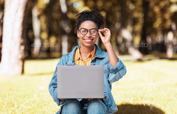 Black Student Woman Using Laptop Learning Online Sitting In Park