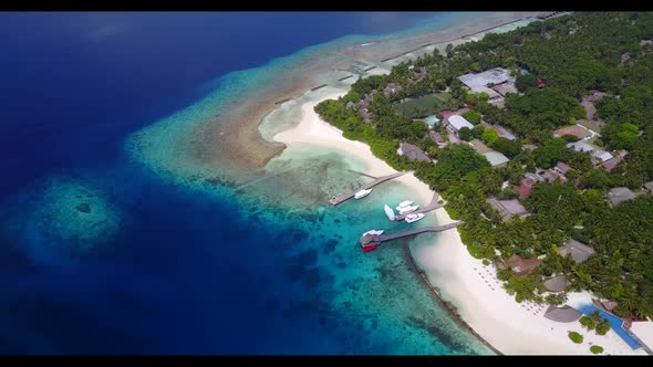 Aerial top view nature of idyllic lagoon beach adventure by aqua blue water with white sandy backgro alt