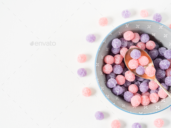 Purple and pink candies in bowl - Stock Photo - Images