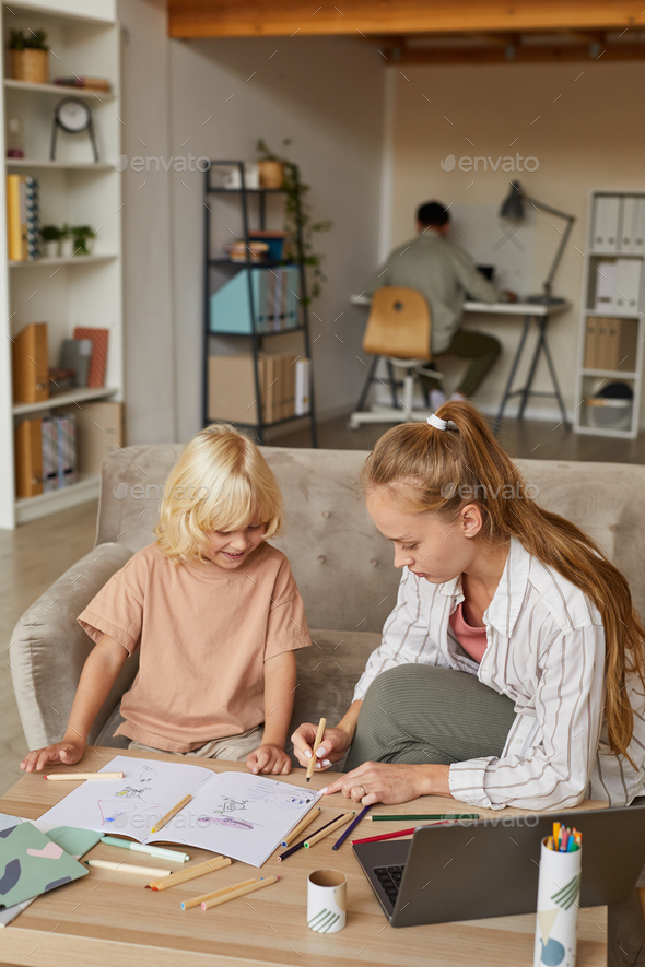 Little boy drawing with mother - Stock Photo - Images