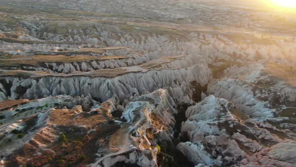 Aerial view of Red Valley and Rose Valley at sunset in Cappadocia, Turkey alt