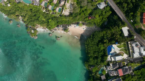 Top Down Overhead View of Luxury Tropical Resorts on a Cliffs Above Sand Beach in Bali alt