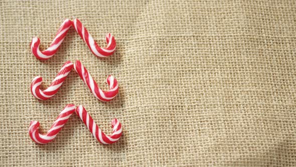Candy cane arranged on textile alt