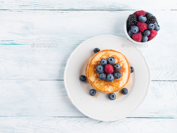 Stack of pancakes with blueberries and syrup - Stock Photo - Images