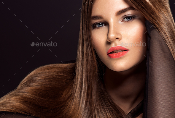 Woman with beauty long brown hair. Beauty woman with living coral color lipstick on lips. - Stock Photo - Images