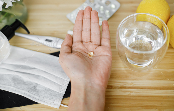 Senior hand with vitamin D, supporting immune system, coronavirus treatment. Stay healthy - Stock Photo - Images