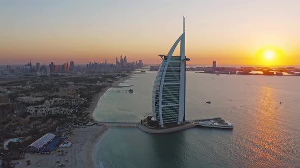 Aerial view of Burj Al Arab Jumeirah Island or boat building, Dubai Downtown skyline, alt