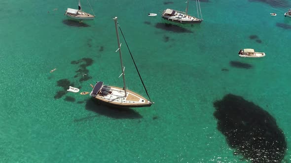 Aerial view of boats anchored in the mediterranean sea, Greece. alt