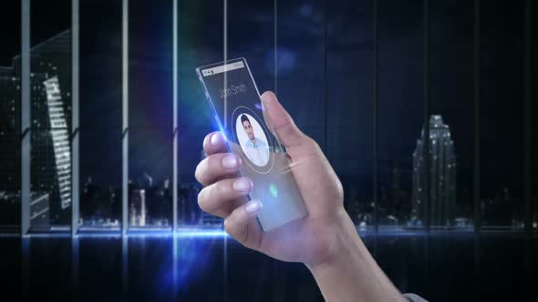 Hand holding futuristic mobile phone against digitally generated background alt