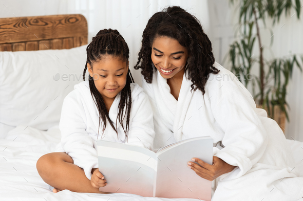 black woman reading magazine