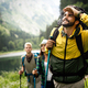 Group of happy hiker friends trekking as part of healthy lifestyle outdoors  activity Stock Photo by nd3000