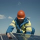 Technician Installing Solar Panel and Looking at Camera - VideoHive Item for Sale