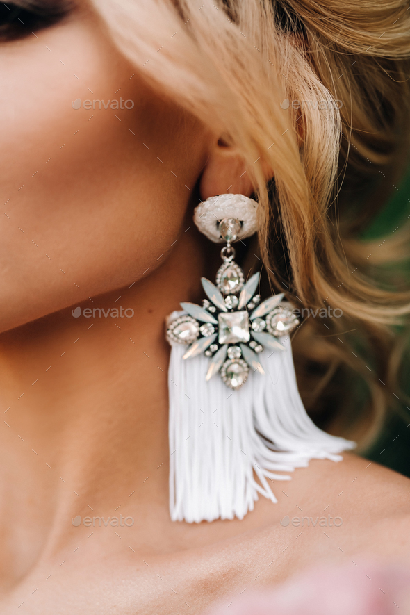 beautiful earrings on the bride, beautiful neck, stylish hairstyle