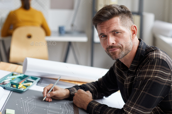Portrait of Mature Architect at Drawing Desk - Stock Photo - Images