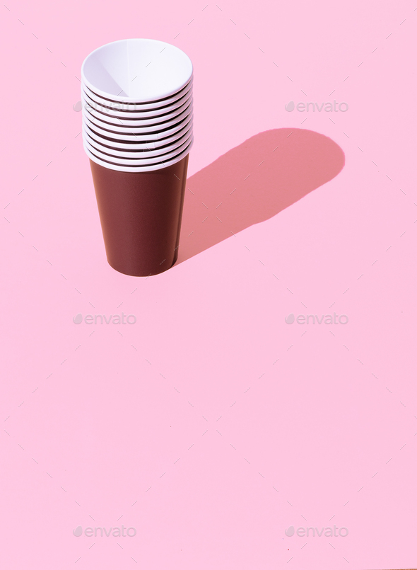 Coffee plastic cups in isometric on pink background. Minimal. Still life art. Plastic free concept