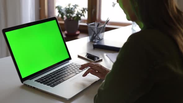 Caucasian Elderly Woman is Working with Laptop at Home Office Space During Quarantine Spbi alt