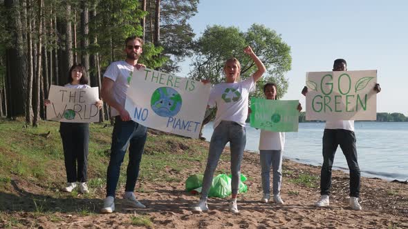 Ecoactivists with Posters in Their Hands Protest Against the Pollution of Nature a Meeting of alt