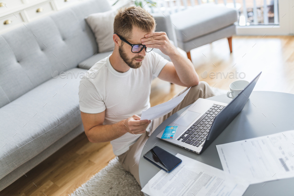 Man working from home during the coronavirus pandemic - Stock Photo - Images