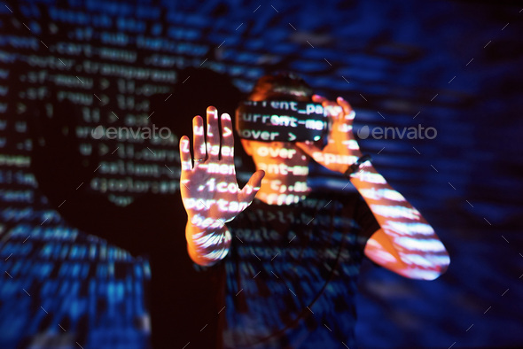 Double exposure of a caucasian man and Virtual reality headset is presumably a gamer or a hacker
