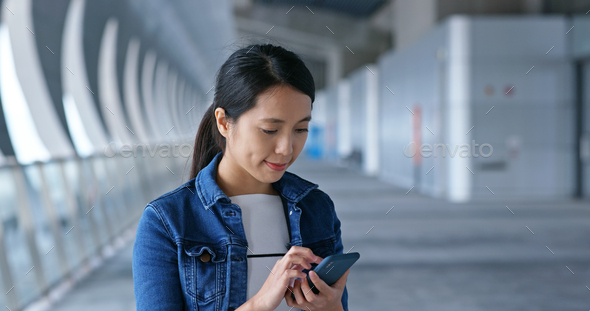 Woman use of mobile phone at street - Stock Photo - Images