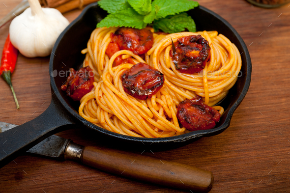 italian spaghetti pasta and tomato with mint leaves - Stock Photo - Images