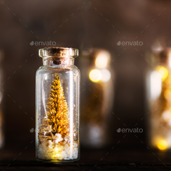 Miniature Gold Christmas Trees in Glass Baubles Stock Photo by Manuta