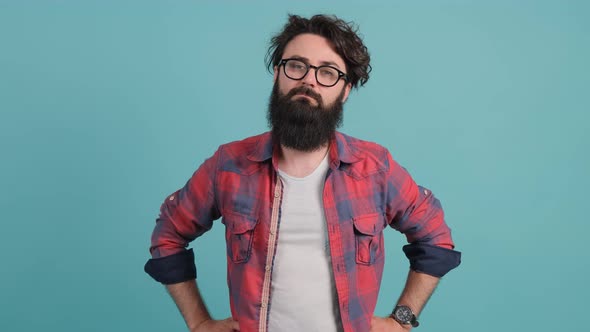 Young Man with Big Beard with Bad Attitude Making Stop Sign Crossing Hands alt